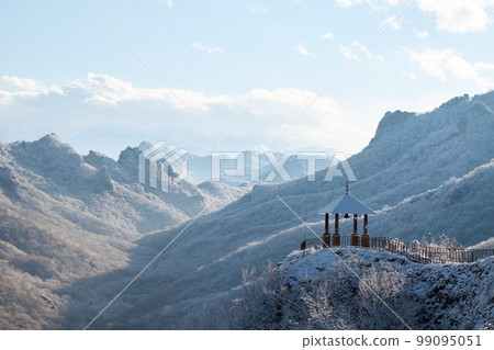 church on rock in snow, monastery on mountain, chapel, pagoda, winter landscape, snow on roof and slopes of mountains, church on rock 99095051