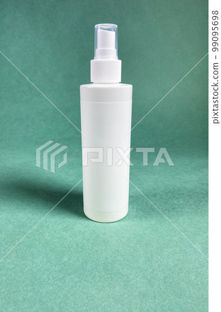 single white blank spray plastic bottle on green 99095698
