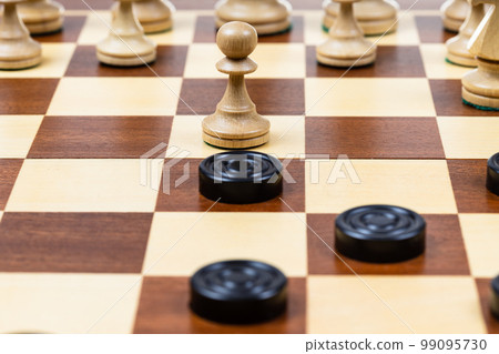 pawn and checkers piece in center of playfield pawn and checkers piece in center of playfield 99095730