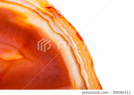 Macro mineral orange agate in crystals on white background 99096411