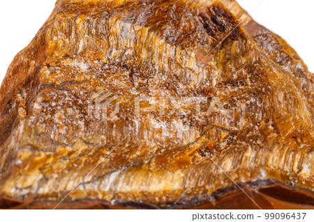 Macro mineral stone Tiger's eye in the breed on a white background 99096437