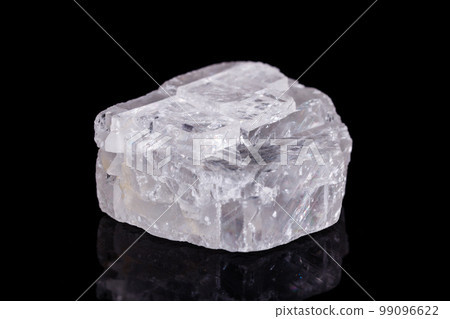Macro mineral stone Iceland spar on black background Macro mineral stone Iceland spar on black background 99096622