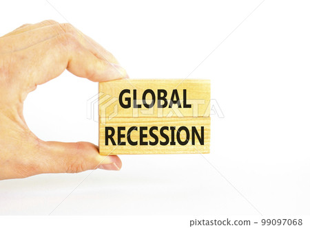 Global recession symbol. Concept words Global recession on wooden blocks. Beautiful white table white background. Businessman hand. Business and global recession concept. Copy space. Global recession symbol. Concept words Global recession on wooden blocks. Beautiful white table white background. Businessman hand. Business and global recession concept. Copy space. 99097068