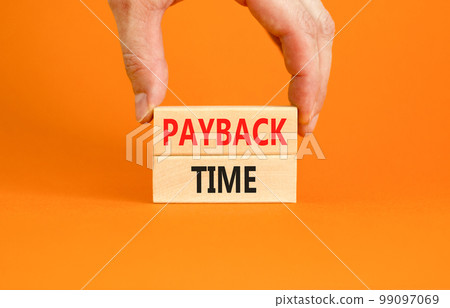 Payback time symbol. Concept words Payback time on wooden blocks. Beautiful orange table orange background. Businessman hand. Business and payback time concept. Copy space. Payback time symbol. Concept words Payback time on wooden blocks. Beautiful orange table orange background. Businessman hand. Business and payback time concept. Copy space. 99097069