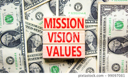 Mission vision values symbol. Concept words Mission Vision Values on wooden blocks on a beautiful background from dollar bills. Business mission vision values concept. Copy space. Mission vision values symbol. Concept words Mission Vision Values on wooden blocks on a beautiful background from dollar bills. Business mission vision values concept. Copy space. 99097081