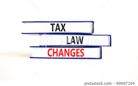 Tax law changes symbol. Concept words Tax law changes on books on a beautiful white table white background. Business tax law changes concept. Copy space. Tax law changes symbol. Concept words Tax law changes on books on a beautiful white table white background. Business tax law changes concept. Copy space. 99097104