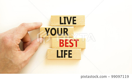 Live your best life symbol. Concept words Live your best life on wooden blocks. Beautiful white table white background. Businessman hand. Business live your best life concept. Copy space. Live your best life symbol. Concept words Live your best life on wooden blocks. Beautiful white table white background. Businessman hand. Business live your best life concept. Copy space. 99097119
