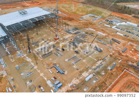 Construction of residential complex involves lot construction equipment which is being used in process Construction of residential complex involves lot construction equipment which is being used in process 99097352