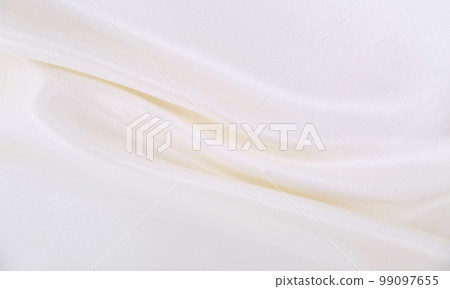 Smooth elegant white silk or satin luxury cloth texture as wedding background. Luxurious background design 99097655