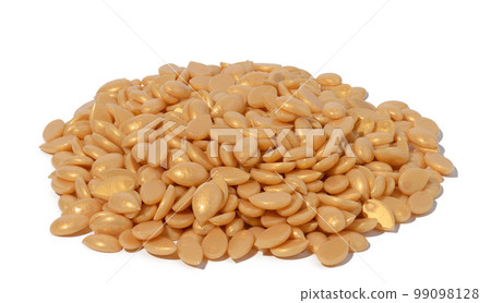 Granules of polymer wax for depilation on a white isolated background Granules of polymer wax for depilation on a white isolated background 99098128