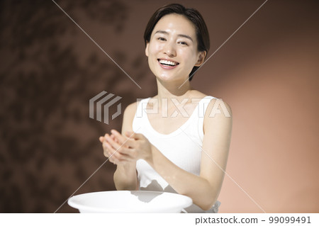 Beauty young woman face wash drop skin care 99099491