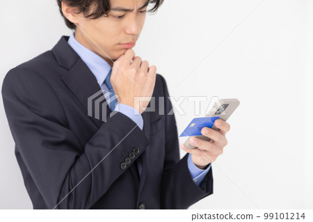 A young man who pays by card, smart phone, worries A young man who pays by card, smart phone, worries 99101214