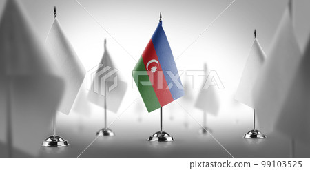 The national flag of the Azerbaijan surrounded by white flags 99103525