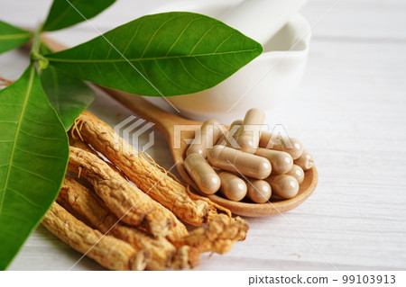 Ginseng roots and green leaf, healthy food. 99103913