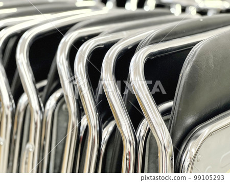 A lot of pipe chairs folded and collected 99105293