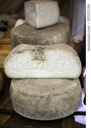 Old cheeses in a market 99105294