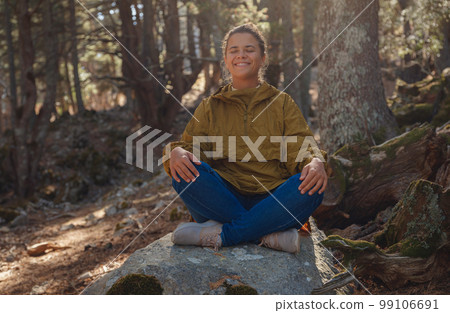 caucasian woman enjoys being in nature, 99106691
