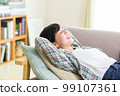 A young woman relaxing on the sofa Relax Nap Break Nap 99107361