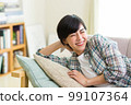 A young woman relaxing on the sofa Relax Nap Break Nap 99107364