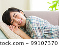 A young woman relaxing on the sofa Relax Nap Break Nap 99107370