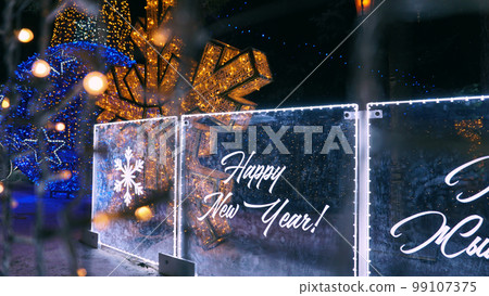 Neon inscription Happy New Year in 2 languages Neon inscription Happy New Year in 2 languages 99107375