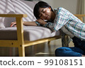 A young woman who is tired on the sofa, poor physical condition, depression, overwork, weather disease, fatigue, lethargy 99108151