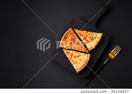 Beautiful delicious quiche pie with four types of cheese with spices and herbs Beautiful delicious quiche pie with four types of cheese with spices and herbs 99108927