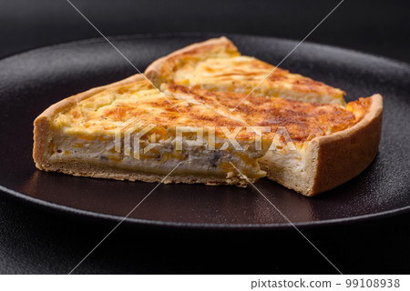 Beautiful delicious quiche pie with four types of cheese with spices and herbs 99108938