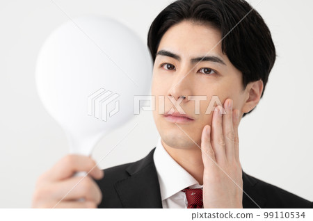 A businessman who cares about his appearance A businessman who cares about his appearance 99110534
