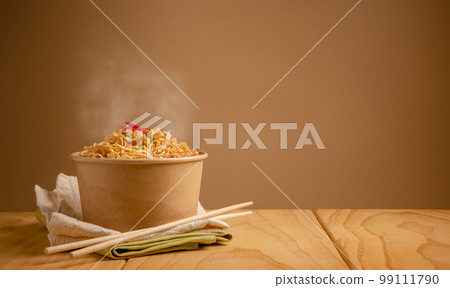 Bow of Hot Boiled Instant Noodles on the Table. Cheap Fast food Concepts. Side View with more Copy Space Bow of Hot Boiled Instant Noodles on the Table. Cheap Fast food Concepts. Side View with more Copy Space 99111790