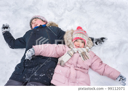 Children play outdoors in winter. Winter vacation Children play outdoors in winter. Winter vacation 99112071