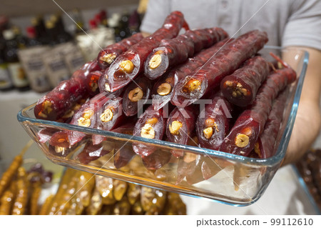Traditional Georgian, Turkish sweets. Homemade sweets with hazelnuts, walnuts, grape juice and honey. 99112610