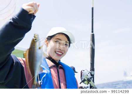 Cute woman enjoying fishing 99114299