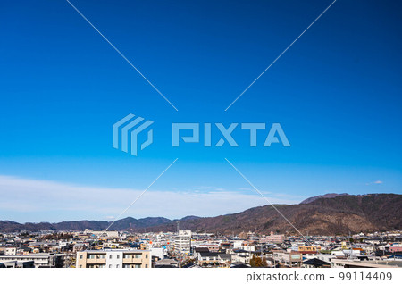 Winter blue sky and townscape Matsumoto City 99114409
