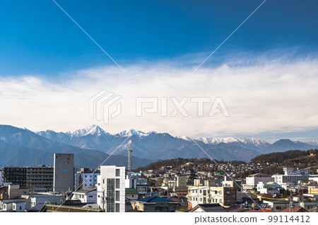 The city of Matsumoto in winter and the Northern Alps The city of Matsumoto in winter and the Northern Alps 99114412