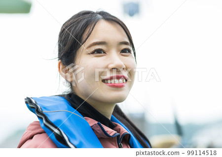 Cute woman enjoying fishing Cute woman enjoying fishing 99114518