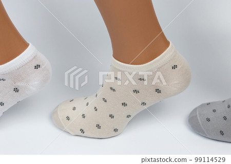 Socks on a white background. Socks on the leg. 99114529