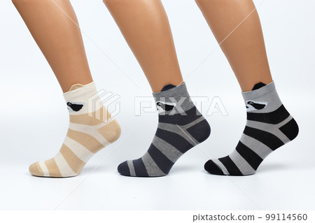 Socks on a white background. Socks on the leg. Socks on a white background. Socks on the leg. 99114560