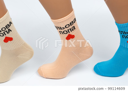 Socks on a white background. Socks on the leg. Socks on a white background. Socks on the leg. 99114609