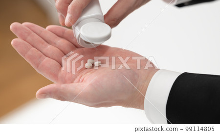 A man holding a supplement Businessman 99114805