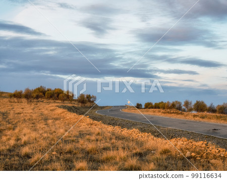 Empty morning highway through the pass, right turn . Beautiful asphalt freeway, motorway, highway through of caucasian landscape mountains hills at cold weather in mid october. Empty morning highway through the pass, right turn . Beautiful asphalt freeway, motorway, highway through of caucasian landscape mountains hills at cold weather in mid october. 99116634