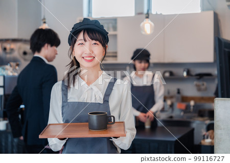 Cafe staff working with a smile 99116727