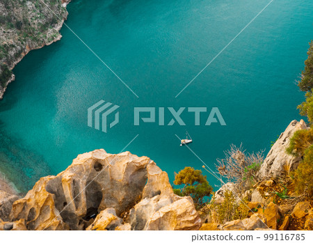 Top view of clear beach and transparent sea of Butterfly Valley. one of the most beautiful beaches in Turkey. 99116785