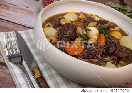 Beef bourguignon recipe, beef stew with wine sauce and vegetables Beef bourguignon recipe, beef stew with wine sauce and vegetables 99117020