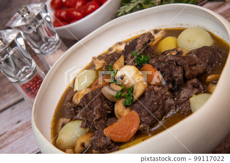 Beef bourguignon recipe, beef stew with wine sauce and vegetables Beef bourguignon recipe, beef stew with wine sauce and vegetables 99117022
