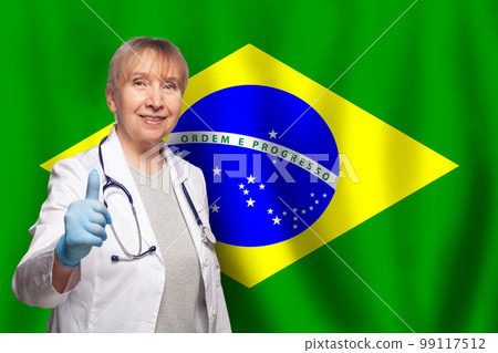 Brazilian smiling mature doctor woman holding stethoscope on flag of Brazil background Brazilian smiling mature doctor woman holding stethoscope on flag of Brazil background 99117512
