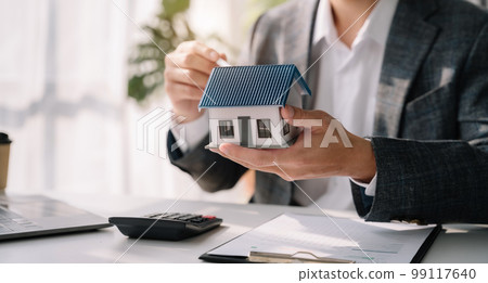 Real estate broker agent presenting and consult to customer to decision making. Real estate broker agent presenting and consult to customer to decision making. 99117640