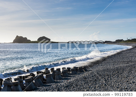 Landscape view of the beautiful eight cross-Sea arch bridge across the pacific ocean coast at Sanxiantai islet (Three Saints Island), East Coast National Scenic Area, Taitung, Taiwan. Landscape view of the beautiful eight cross-Sea arch bridge across the pacific ocean coast at Sanxiantai islet (Three Saints Island), East Coast National Scenic Area, Taitung, Taiwan. 99119783