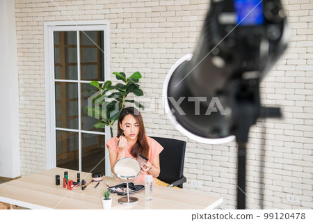 Behind the scene. Beauty blogger record video with studio lighting 99120478