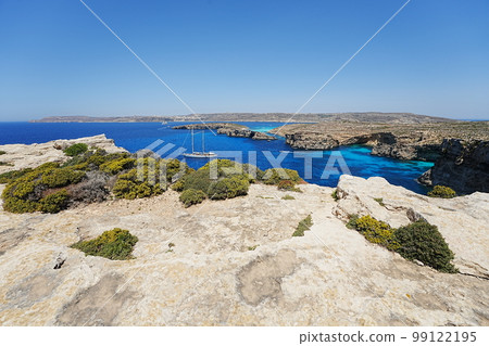Yacht and european Comino island with blue lagoon in Malta Yacht and european Comino island with blue lagoon in Malta 99122195